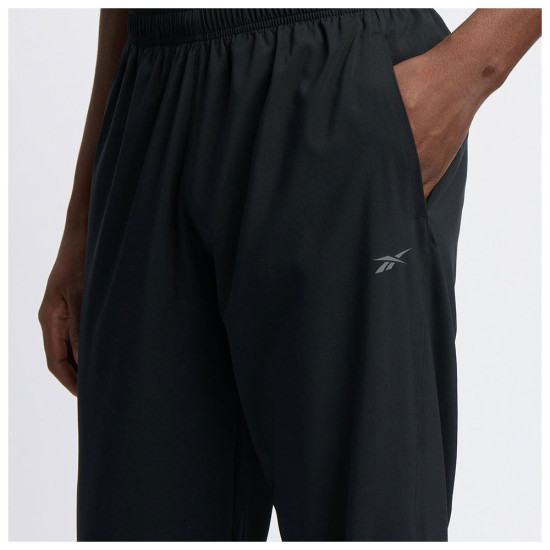 Reebok Ανδρικό παντελόνι φόρμας Identity Train Woven Open Hem Track Pants Reebok Ανδρικό παντελόνι φόρμας Identity Train Woven Open Hem Track Pants